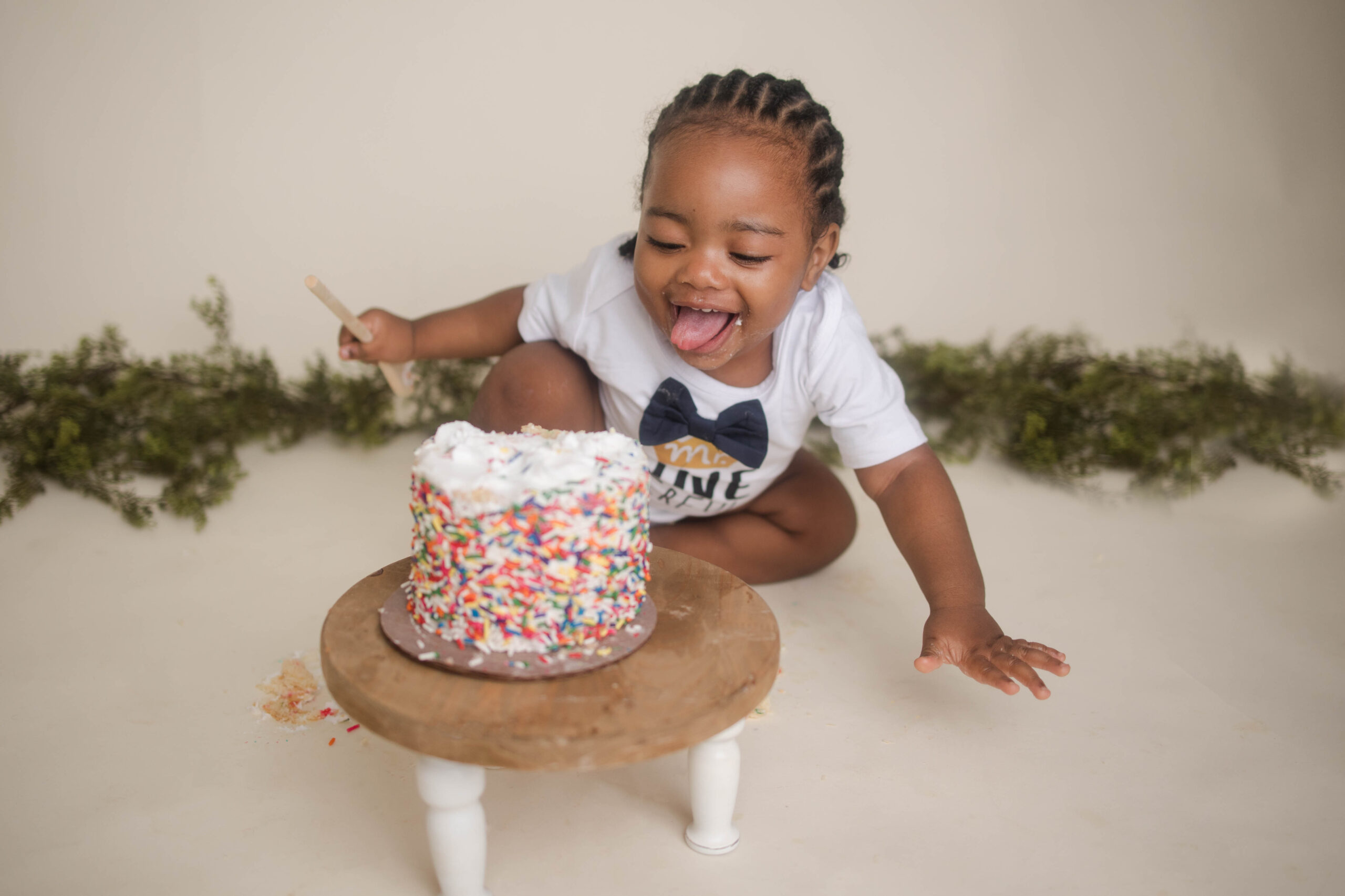 One year old boy eating cake for first birthday. Millbury Massachusetts